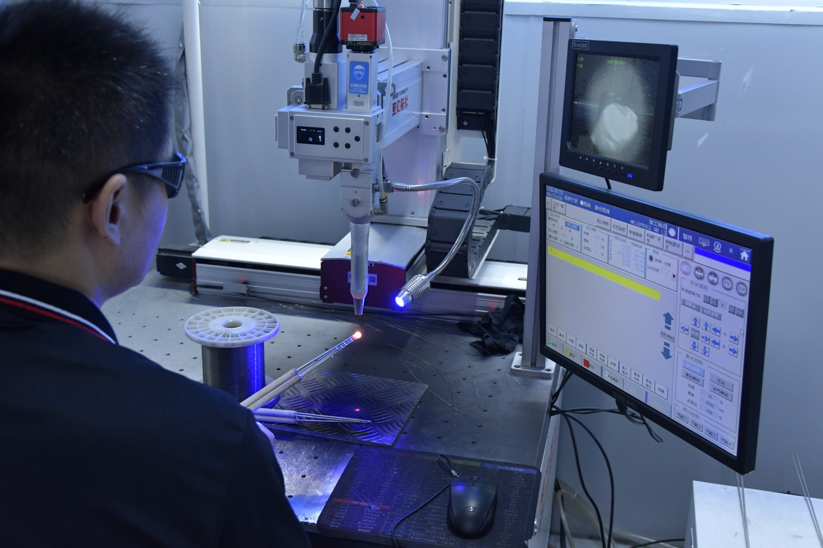 Thermocouple reference tables and wire samples on an engineering bench
